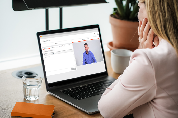 Young woman watching a Video Lecture on a laptop