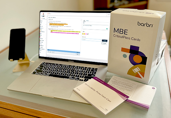 Laptop showing the online flashcards with a box set of MBE CriticalPass Cards